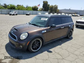 2009 MINI Clubman S z VIN WMWMM33569TP74924, wystawiony jako Copart lot #59406285 z przebiegiem 101 431 mil mil oraz Szkoda całkowita • Salvage title. Historia ofert i sprzedaży dostępna na DreamBid. Obrazek 1.