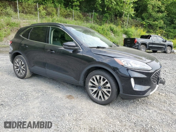 2020 Ford Escape Titanium с VIN 1FMCU9J97LUA20595, выставлен на аукционе Copart как лот 59476745 с пробегом 74 518 миль миль и Списание • Salvage title. История ставок и продаж доступна на DreamBid. Изображение 4.
