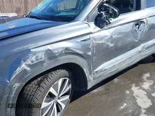 2024 Volkswagen Taos SE z VIN 3VVEX7B20RM075155, wystawiony jako IAAI lot #41709198 z przebiegiem 4 810 mil mil oraz . Historia ofert i sprzedaży dostępna na DreamBid. Obrazek 6.