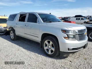 2015 Chevrolet Suburban LTZ with VIN 1GNSKKKC1FR120164, listed as a Copart auction lot 53700455 with 195,815 mi miles and Salvage Title. Bid and sale history available at DreamBid. Image 4.
