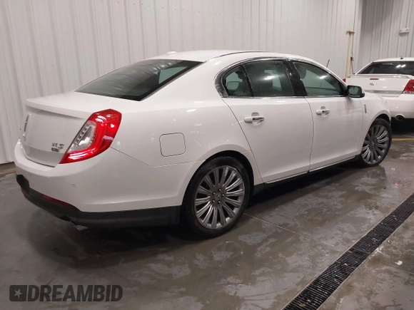 2014 Lincoln MKS with VIN 1LNHL9EK5EG605750, listed as a IAAI auction lot 41565308 with 167,835 mi miles. Bid and sale history available at carsss.com. Image 4.