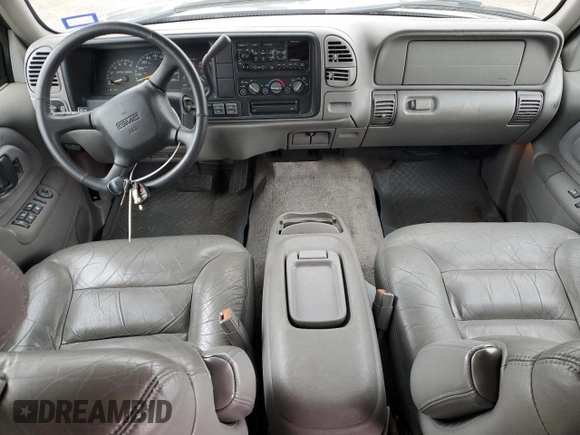 1999 GMC Suburban z VIN 1GKFK16R0XJ772880, wystawiony jako Copart lot #46986325 z przebiegiem 237 921 mil mil oraz Czysty tytuł • Clean title. Historia ofert i sprzedaży dostępna na DreamBid. Obrazek 8.