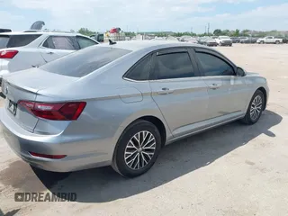 2021 Volkswagen Jetta S z VIN 3VWC57BU9MM015930, wystawiony jako IAAI lot #42020727 z przebiegiem 67 982 mil mil oraz . Historia ofert i sprzedaży dostępna na DreamBid. Obrazek 4.
