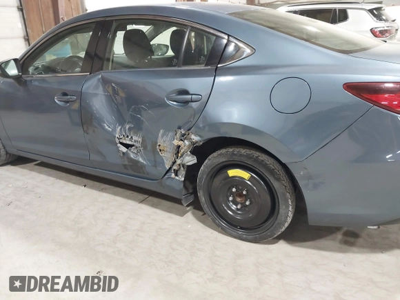 2014 Mazda 6 i Sport with VIN JM1GJ1U61E1148983, listed as a IAAI auction lot 41977553 with 100,668 mi miles and . Bid and sale history available at DreamBid. Image 13.