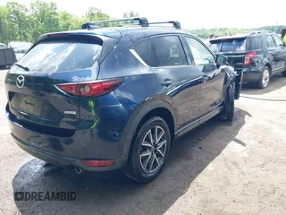 2018 Mazda CX-5 Grand Touring with VIN JM3KFBDM2J0373386, listed as a IAAI auction lot 42200795 with 70,111 mi miles and . Bid and sale history available at DreamBid. Image 4.