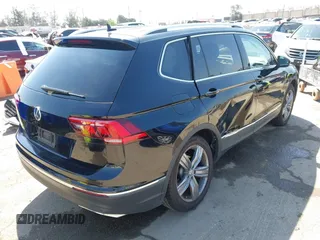 2021 Volkswagen Tiguan SE with VIN 3VV3B7AX1MM045478, listed as a IAAI auction lot 41947899 with 56,694 mi miles and . Bid and sale history available at DreamBid. Image 4.