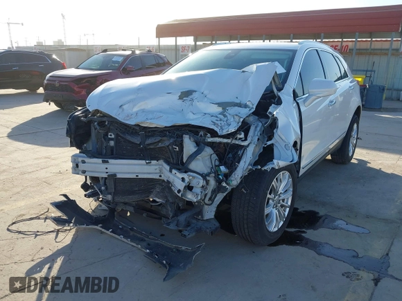 2018 Cadillac XT5 Luxury FWD z VIN 1GYKNCRS3JZ143354, wystawiony jako IAAI lot #41973536 z przebiegiem 101 327 mil mil oraz . Historia ofert i sprzedaży dostępna na DreamBid. Obrazek 19.