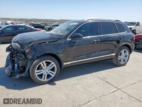 2013 Volkswagen Touareg Exec z VIN WVGEF9BPXDD007602, wystawiony jako Copart lot #50031785 z przebiegiem 93 859 mil mil oraz Szkody całkowita. Historia ofert i sprzedaży dostępna na DreamBid. Obrazek 1.