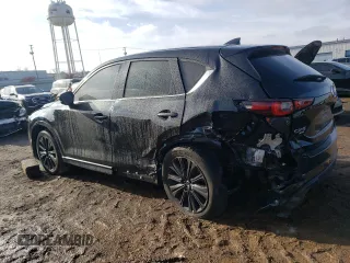 2022 Mazda CX-5 2.5 Turbo with VIN JM3KFBAY5N0647340, listed as a Copart auction lot 85123474 with 68,510 mi miles and Salvage Title. Bid and sale history available at carsss.com. Image 2.