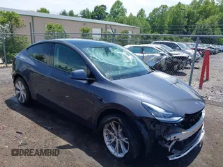 2023 Tesla Model Y Long Range with VIN 7SAYGAEE7PF615751, listed as a IAAI auction lot 42297819 with 31,201 mi miles and . Bid and sale history available at DreamBid. Image 1.