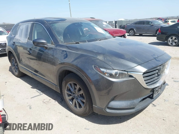 2021 Mazda CX-9 Touring with VIN JM3TCACY2M0502016, listed as a IAAI auction lot 41825456 with 86,068 mi miles. Bid and sale history available at carsss.com. Image 1.