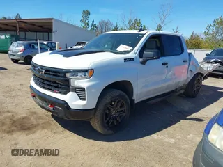 2023 Chevrolet Silverado 1500 LT Trail Boss with VIN 3GCUDFEDXPG253353, listed as a IAAI auction lot 41622661 with 36,487 mi miles and . Bid and sale history available at DreamBid. Image 2.