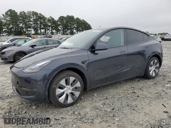 2024 Tesla Model Y Long Range with VIN 7SAYGAEE7RF005786, listed as a Copart auction lot 58415195 with 8,700 mi miles and Salvage title. Bid and sale history available at DreamBid. Image 1.