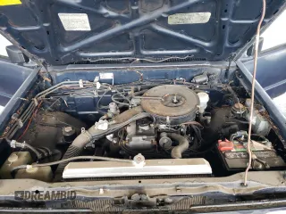 1988 Mitsubishi Mighty Max z VIN JA7FL29E9JP027859, wystawiony jako Copart lot #48638175 z przebiegiem 136 441 mil mil oraz Czysty tytuł • Clean title. Historia ofert i sprzedaży dostępna na DreamBid. Obrazek 11.