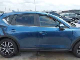 2018 Mazda CX-5 Touring z VIN JM3KFACM5J1442416, wystawiony jako IAAI lot #42093137 z przebiegiem 65 102 mil mil oraz . Historia ofert i sprzedaży dostępna na DreamBid. Obrazek 14.
