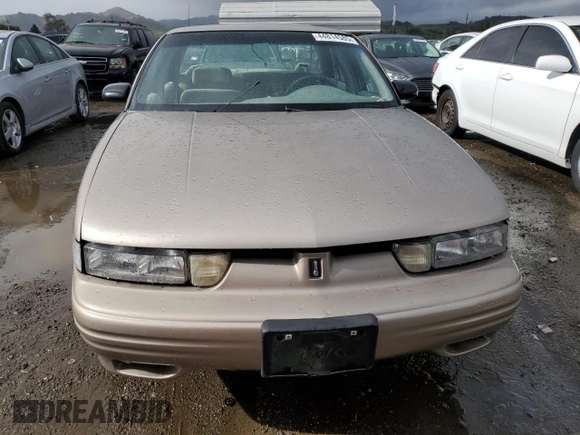 1996 Oldsmobile Cutlass Supreme S z VIN 1G3WH52M1TF334801, wystawiony jako Copart lot #44814585 z przebiegiem 106 295 mil mil oraz Szkody całkowita. Historia ofert i sprzedaży dostępna na DreamBid. Obrazek 5.