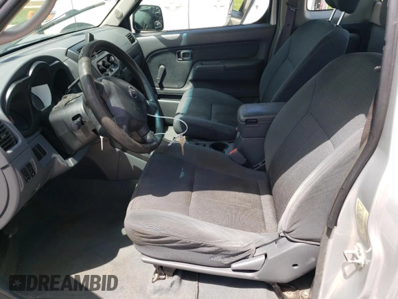 2004 Nissan Frontier XE with VIN 1N6DD26T34C454425, listed as a Copart auction lot 52404115 with 317,899 mi miles and Salvage title. Bid and sale history available at DreamBid. Image 7.