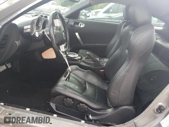 2004 Nissan 350Z Touring with VIN JN1AZ34D24M103656, listed as a Copart auction lot 55100955 with 130,561 mi miles and Salvage title. Bid and sale history available at DreamBid. Image 7.