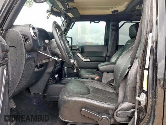 2015 Jeep Wrangler Unlimited Rubicon Hard Rock with VIN 1C4HJWFG1FL710264, listed as a Copart auction lot 54123285 with 96,737 mi miles and Salvage title. Bid and sale history available at DreamBid. Image 7.