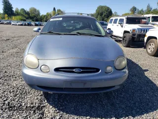 1999 Ford Taurus SE Standard with VIN 1FAFP58U9XG271897, listed as a Copart auction lot 73048784 with 190,518 mi miles and Salvage title. Bid and sale history available at DreamBid. Image 5.