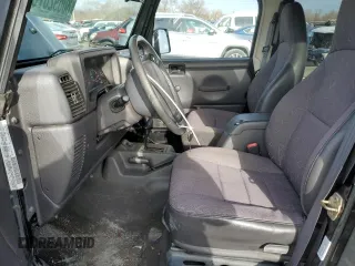 2002 Jeep Wrangler Sport with VIN 1J4FA49S32P758082, listed as a Copart auction lot 80692073 with 148,784 mi miles and Salvage Title. Bid and sale history available at carsss.com. Image 7.