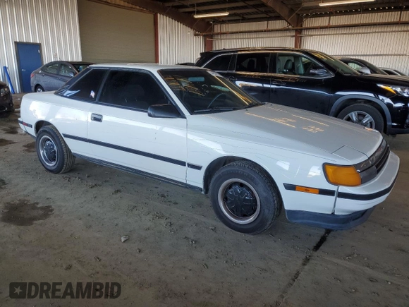 1986 Toyota Celica z VIN JT2ST64CXG7013064, wystawiony jako Copart lot #44228575 z przebiegiem 101 881 mil mil oraz Szkoda całkowita • Salvage title. Historia ofert i sprzedaży dostępna na DreamBid. Obrazek 4.