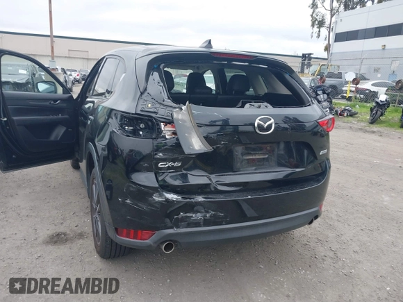2018 Mazda CX-5 Grand Touring with VIN JM3KFADM4J0326760, listed as a IAAI auction lot 41885100 with 82,091 mi miles and . Bid and sale history available at DreamBid. Image 6.