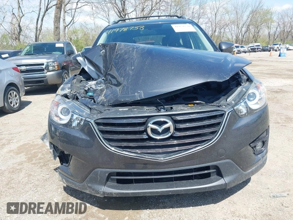 2016 Mazda CX-5 Touring with VIN JM3KE4CYXG0620990, listed as a IAAI auction lot 41978738 with 91,237 mi miles and . Bid and sale history available at carsss.com. Image 12.