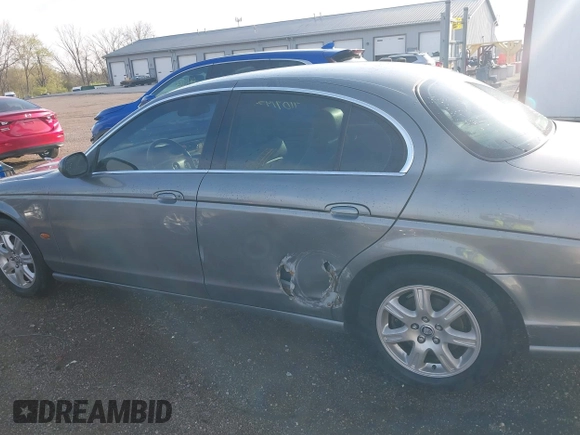 2003 Jaguar S-Type with VIN SAJEA01T23FM93839, listed as a IAAI auction lot 41891973 with 153,761 mi miles and . Bid and sale history available at DreamBid. Image 14.