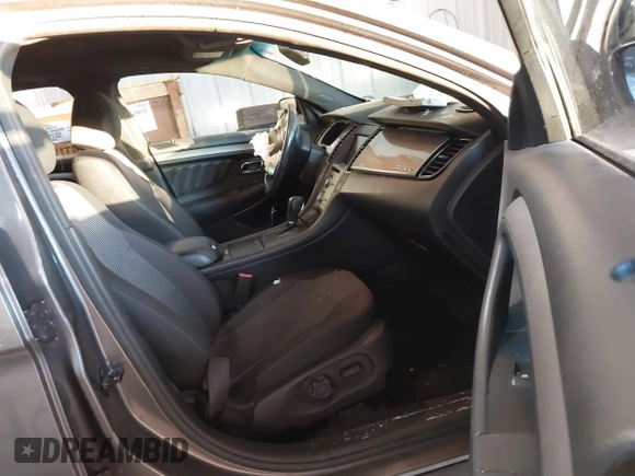 2013 Ford Taurus SEL z VIN 1FAHP2E89DG150197, wystawiony jako IAAI lot #41214999 z przebiegiem 146 307 mil mil oraz . Historia ofert i sprzedaży dostępna na DreamBid. Obrazek 5.