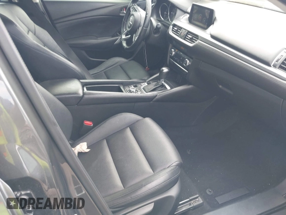 2017 Mazda 6 Touring with VIN JM1GL1V57H1127804, listed as a IAAI auction lot 41515342 with 107,336 mi miles and . Bid and sale history available at carsss.com. Image 5.