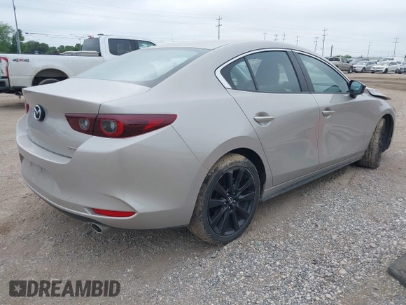 2025 Mazda 3 S Select Sport with VIN JM1BPABM5S1762571, listed as a IAAI auction lot 42186857 with 12,189 mi miles and . Bid and sale history available at DreamBid. Image 4.