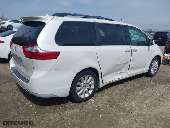 2015 Toyota Sienna XLE with VIN 5TDYK3DC0FS570007, listed as a IAAI auction lot 41794333 with 217,512 mi miles. Bid and sale history available at carsss.com. Image 4.