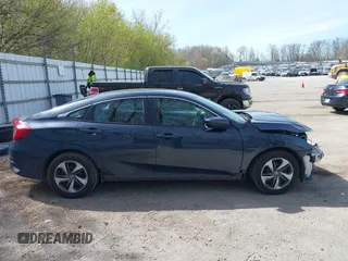2021 Honda Civic LX z VIN 19XFC2F65ME000324, wystawiony jako IAAI lot #42137375 z przebiegiem 78 473 mil mil oraz . Historia ofert i sprzedaży dostępna na DreamBid. Obrazek 13.