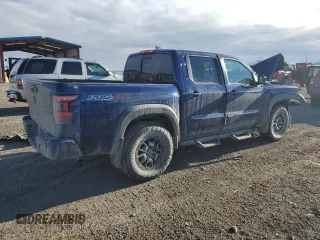 2023 Nissan Frontier Pro-4X z VIN 1N6ED1EK0PN610517, wystawiony jako Copart lot #87213324 z przebiegiem 51 648 mil mil oraz Szkoda całkowita • Salvage title. Historia ofert i sprzedaży dostępna na DreamBid. Obrazek 3.