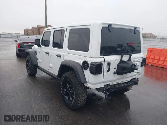 2023 Jeep Wrangler Sport with VIN 1C4HJXDN8PW523532, listed as a IAAI auction lot 41962483 with 14,643 mi miles and . Bid and sale history available at DreamBid. Image 3.