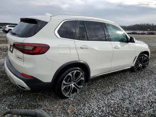 2021 BMW X5 sDrive40i with VIN 5UXCR4C04M9E30879, listed as a Copart auction lot 39577953 with 19,276 mi miles. Bid and sale history available at carsss.com. Image 3.