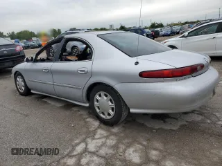 1997 Mercury Sable GS z VIN 1MELM50U4VG609283, wystawiony jako Copart lot #66853354 z przebiegiem Nie podano mil oraz Szkody całkowita. Historia ofert i sprzedaży dostępna na DreamBid. Obrazek 2.