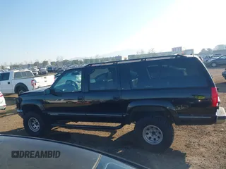 1999 GMC Suburban with VIN 3GKEC16R7XG527908, listed as a IAAI auction lot 41657788 with 216,894 mi miles. Bid and sale history available at carsss.com. Image 14.