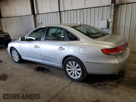 2010 Hyundai Azera GLS with VIN KMHFC4DD7AA473519, listed as a Copart auction lot 71422234 with 120,080 mi miles and Salvage title. Bid and sale history available at DreamBid. Image 2.