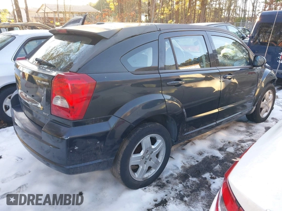2009 Dodge Caliber SXT with VIN 1B3HB48A89D118869, listed as a IAAI auction lot 41315552 with 198,986 mi miles and . Bid and sale history available at DreamBid. Image 4.