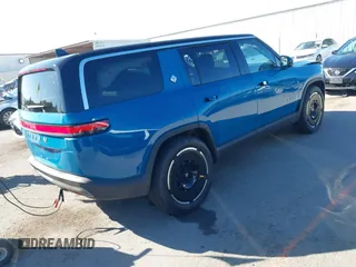 2025 Rivian R1S Adventure with VIN 7PDSGBBA9SN056202, listed as a IAAI auction lot 40766927 with 1,688 mi miles. Bid and sale history available at carsss.com. Image 4.