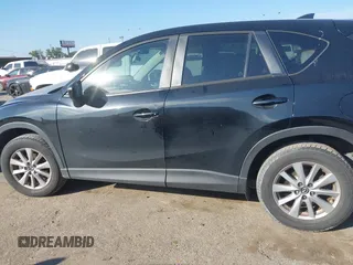2016 Mazda CX-5 Touring with VIN JM3KE2CY6G0808992, listed as a IAAI auction lot 40969655 with 132,513 mi miles. Bid and sale history available at carsss.com. Image 14.