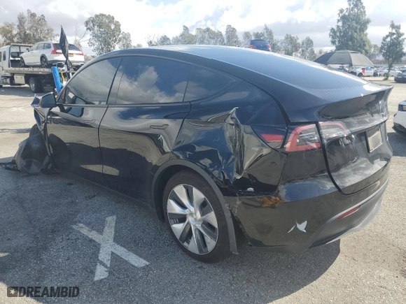 2023 Tesla Model Y Long Range with VIN 7SAYGDEE2PA111557, listed as a Copart auction lot 45561135 with 22,142 mi miles and Salvage Title. Bid and sale history available at carsss.com. Image 2.
