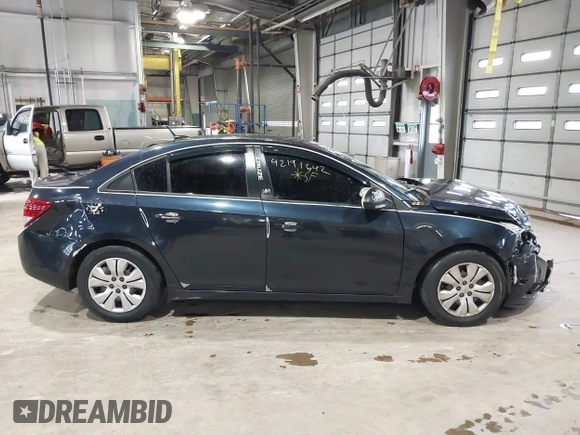 2014 Chevrolet Cruze LS z VIN 1G1PA5SH3E7473796, wystawiony jako IAAI lot #42191642 z przebiegiem 63 873 mil mil oraz . Historia ofert i sprzedaży dostępna na DreamBid. Obrazek 13.
