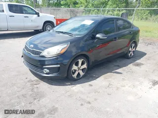 2016 Kia Rio EX with VIN KNADN4A34G6575984, listed as a IAAI auction lot 42133630 with 126,704 mi miles. Bid and sale history available at carsss.com. Image 2.