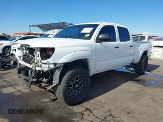 2014 Toyota Tacoma with VIN 3TMMU4FN9EM062808, listed as a IAAI auction lot 41450058 with 192,628 mi miles and . Bid and sale history available at DreamBid. Image 18.