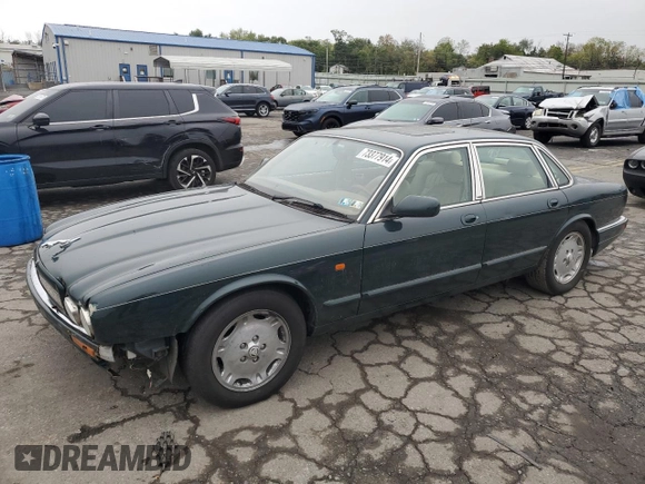 1996 Jaguar XJ with VIN SAJHX1741TC758740, listed as a Copart auction lot 73377914 with 140,964 mi miles and Salvage title. Bid and sale history available at DreamBid. Image 1.