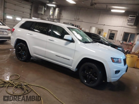 2015 Jeep Grand Cherokee Laredo with VIN 1C4RJFAG4FC660665, listed as a IAAI auction lot 41529532 with 124,099 mi miles. Bid and sale history available at carsss.com. Image 1.