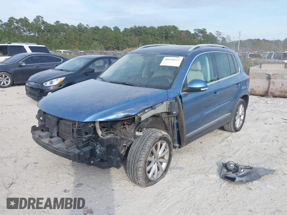 2017 Volkswagen Tiguan Wolfsburg Edition with VIN WVGRV7AX6HW504313, listed as a IAAI auction lot 40950812 with 149,884 mi miles and . Bid and sale history available at DreamBid. Image 2.